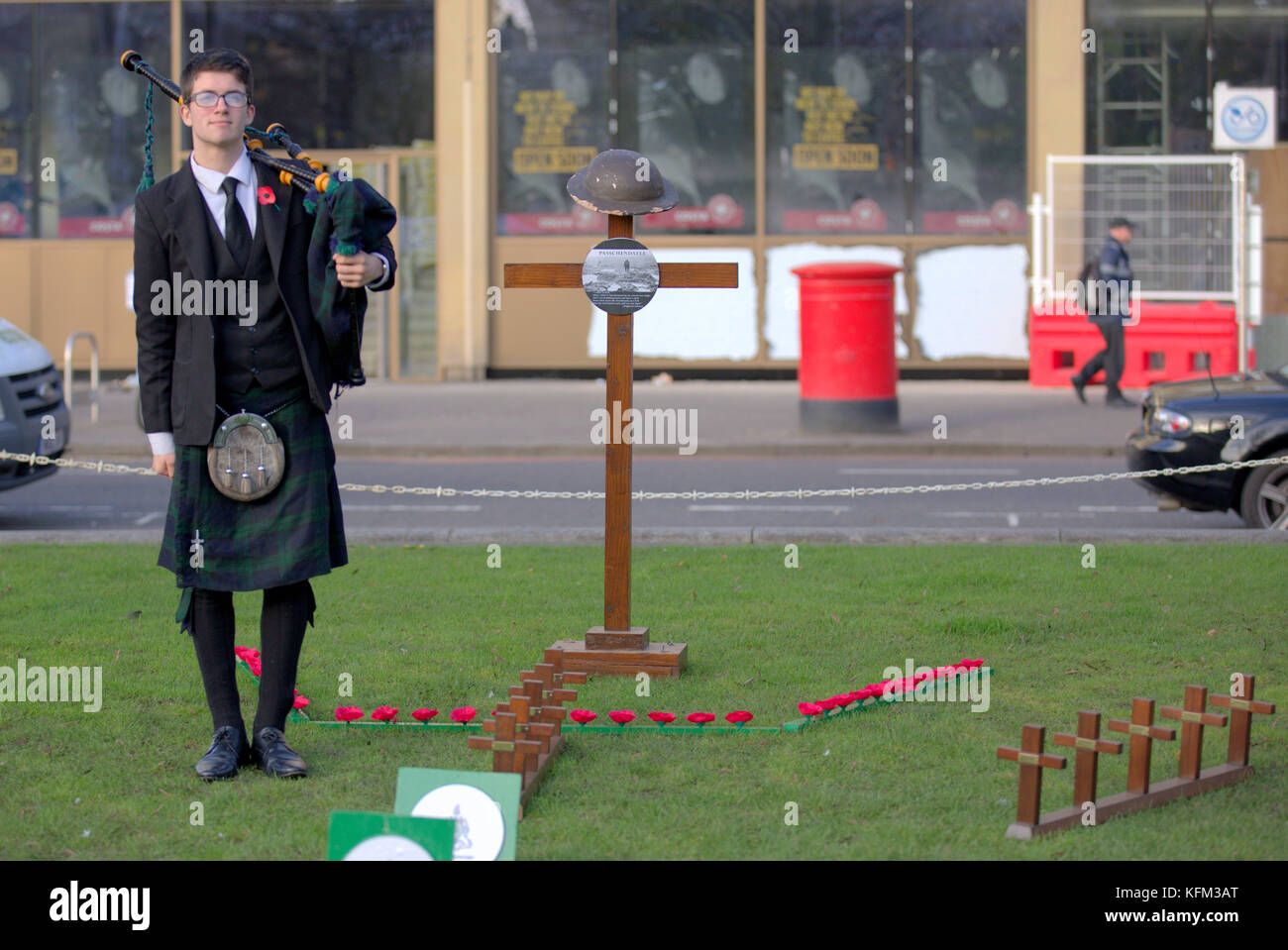 Glasgow, Scotland, UK 30h October. The Remembrance Garden in George Square was visited by piper Danny Haggerty ahead of  its inauguration ceremony tomorrow  and as the city begins its path towards remembrance Sunday there is  a poppy appeal pop up shop on Buchanan street. Credit Gerard Ferry/Alamy news Stock Photo