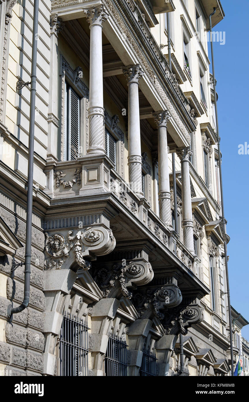 Massive stone first floor stone loggia, bracketed off grand apartment building Stock Photo