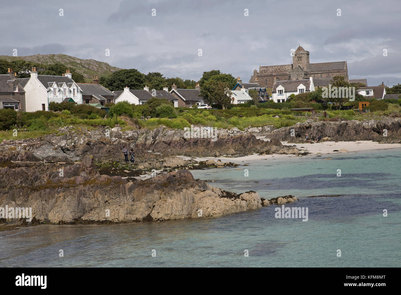Iona Abbey and coastal houses seen from Sound of Mull Scotland Stock