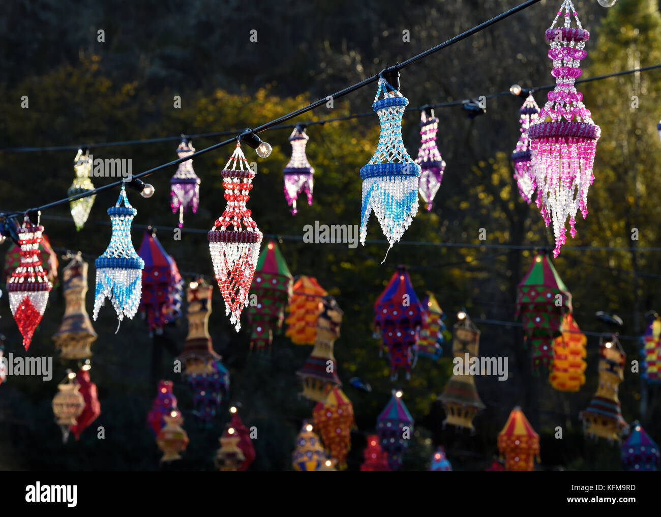 Coloured lanterns hang up in Princes Street Gardens, Edinburgh during the annual Diwali celebrations. Stock Photo