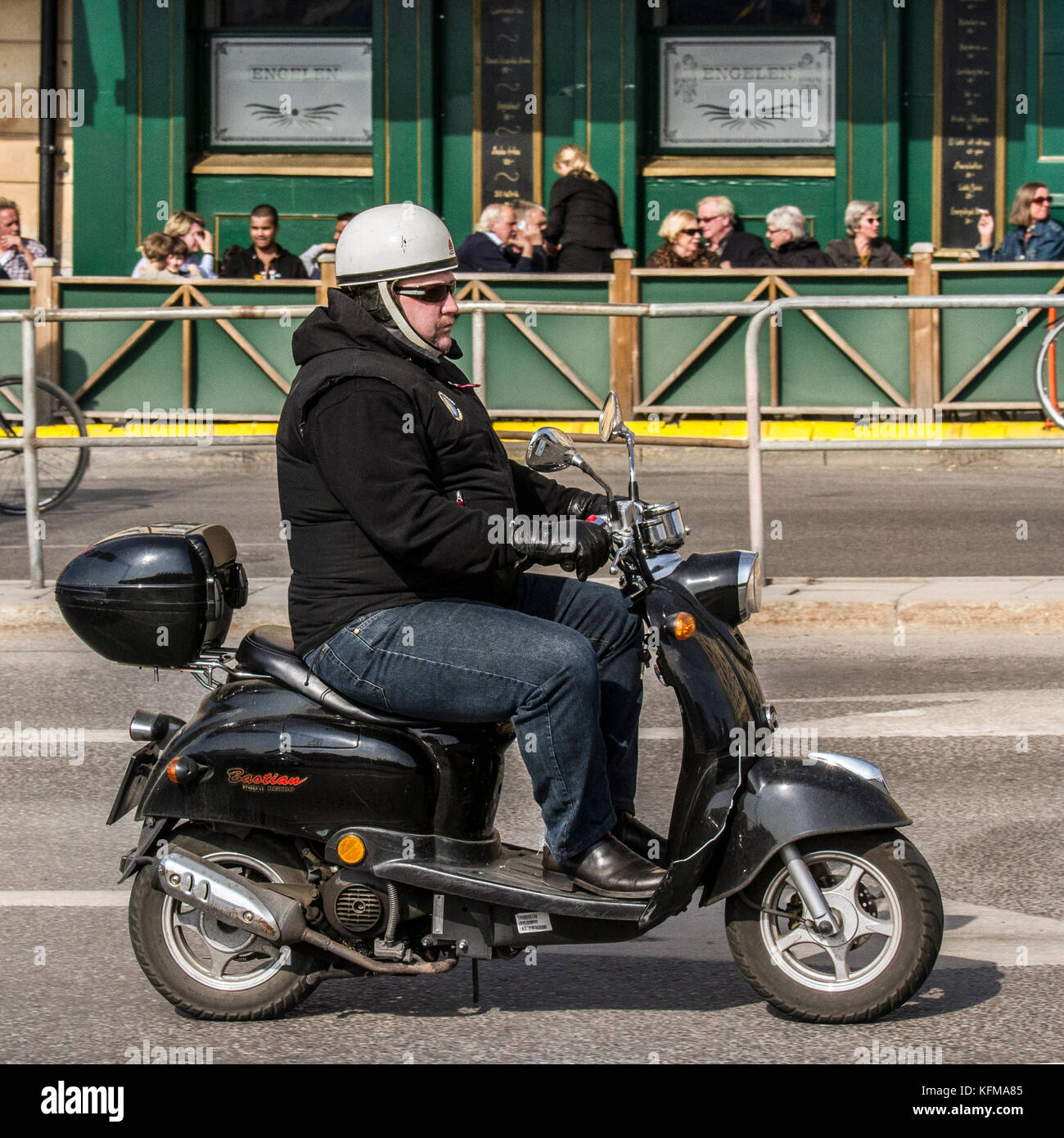 Man på scooter / Man on a scooter Stock Photo