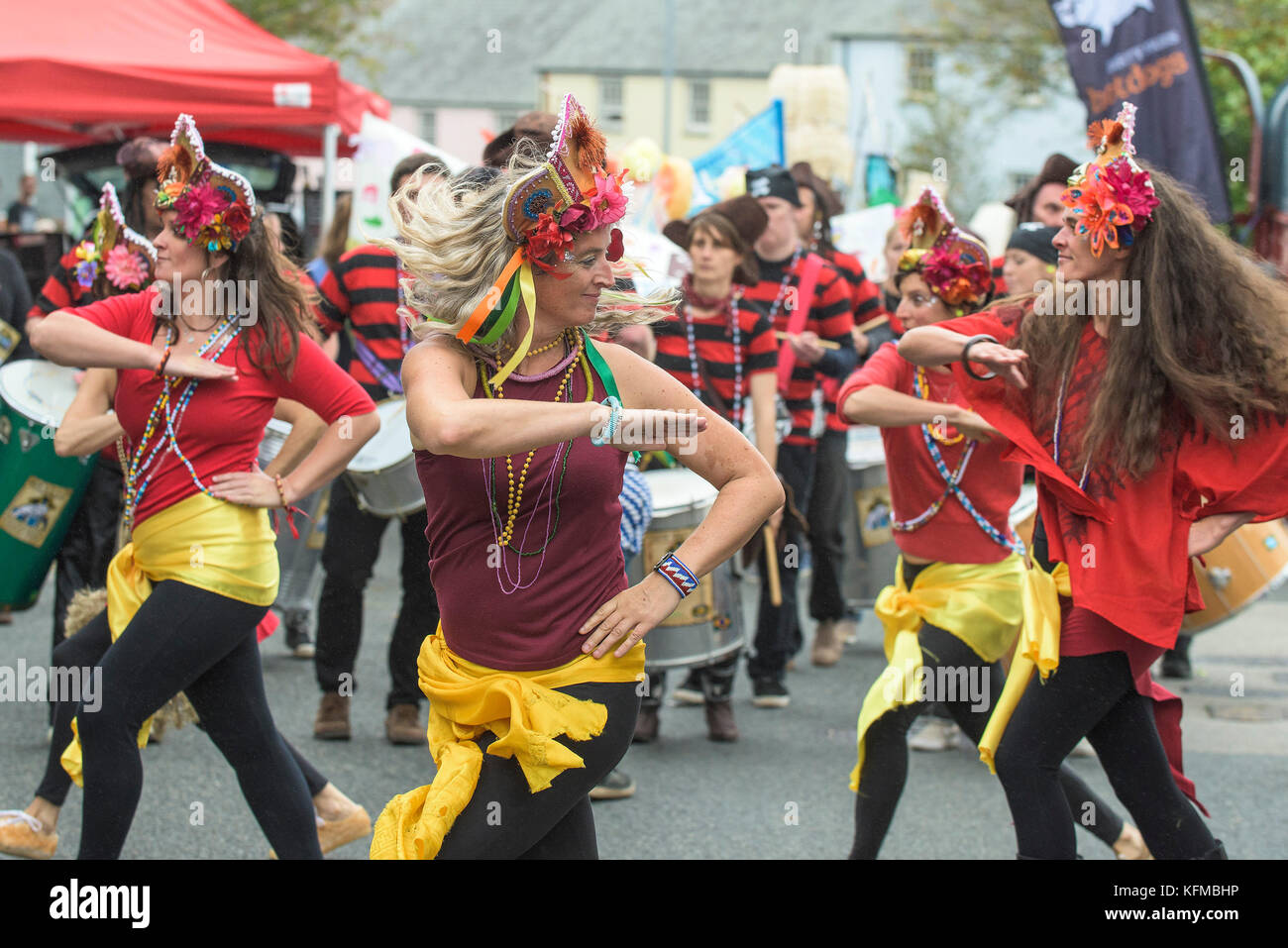 Penryn Kemeneth a two day heritage festival at Penryn Cornwall - DakaDoum Samba Band and dancers performing through the streets of Penryn. Stock Photo