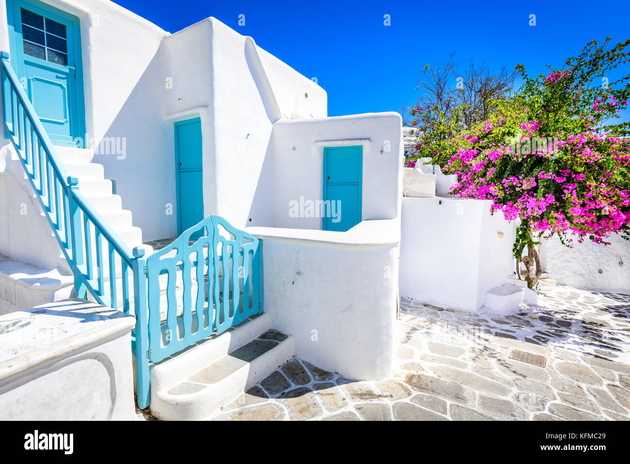 Mykonos, Greece. Whitewashed dotted alley in old city, Cyclades Greek Islands. Stock Photo