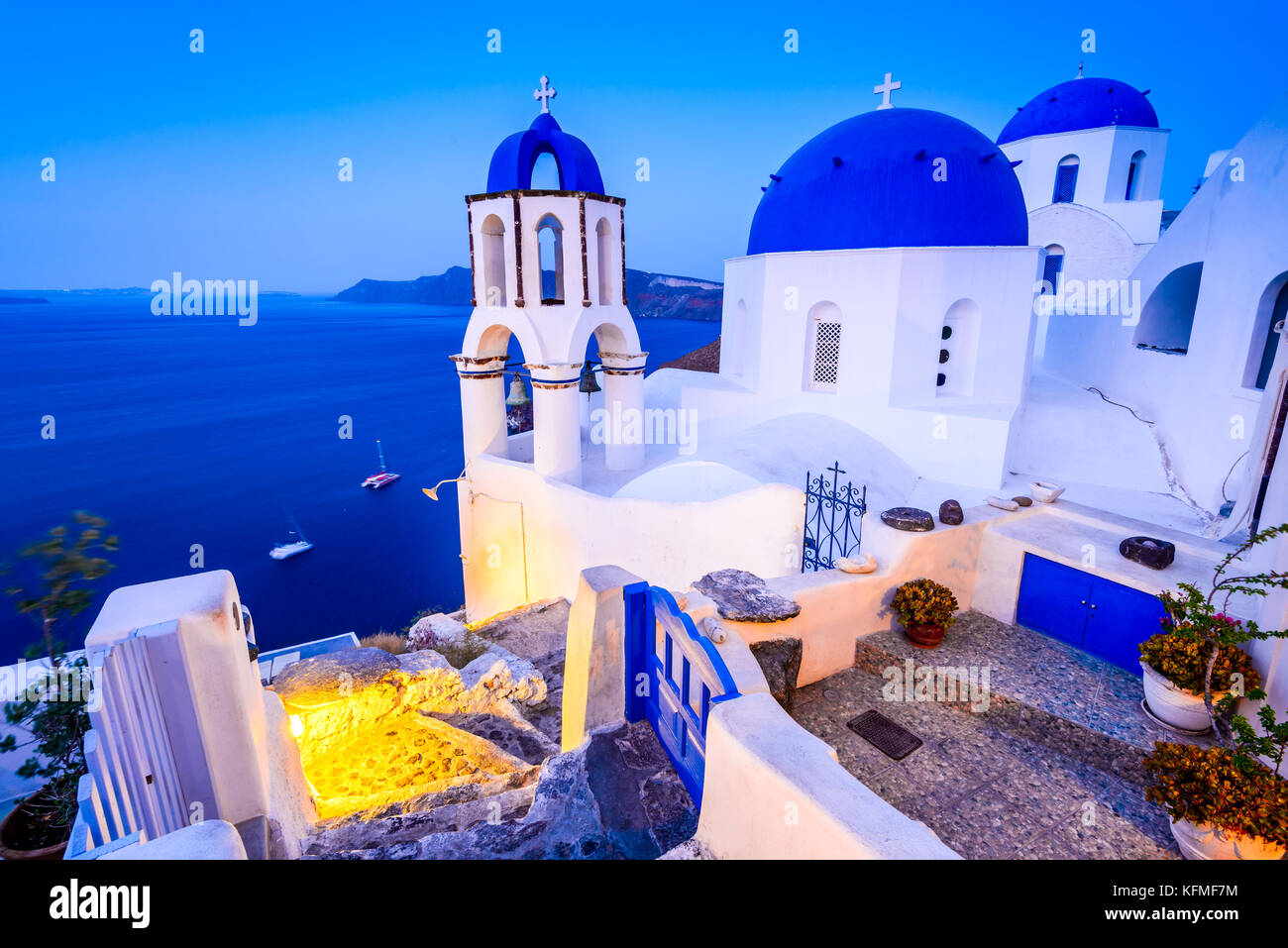 Santorini, Greece. Oia white village with cobbled paths, greek orthodox blue church. Stock Photo