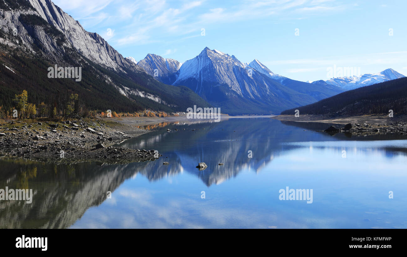 Reflections on a tranquil lake in the Rocky Mountains Stock Photo - Alamy