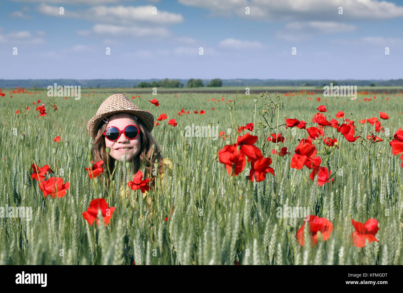 happy little girl in meadow spring season Stock Photo - Alamy
