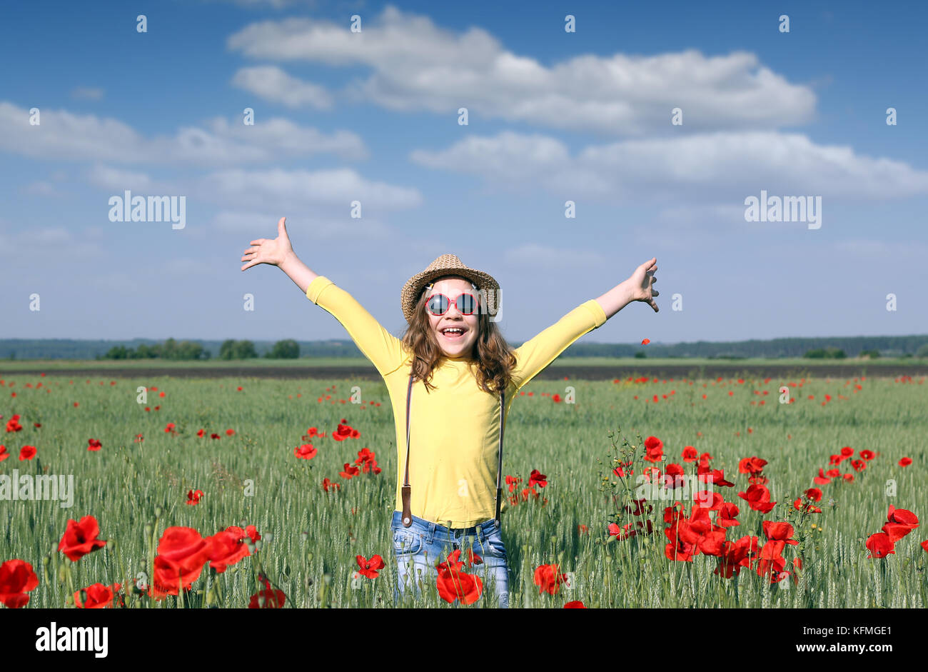 happy little girl on spring meadow Stock Photo - Alamy