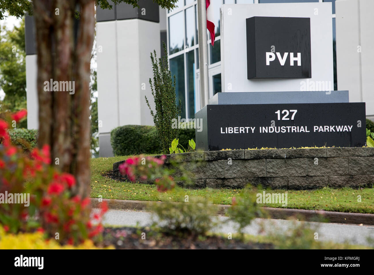 A logo sign outside of a facility occupied by the PVH Corporation