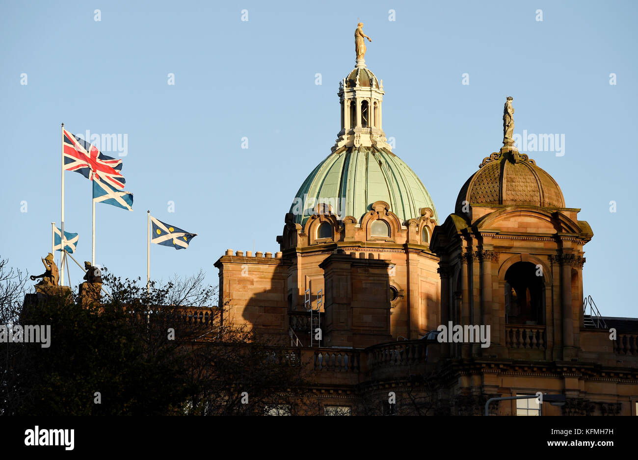 Flags fly from the top of the Bank of Scotland headquarters on the Mound, Edinburgh. Stock Photo