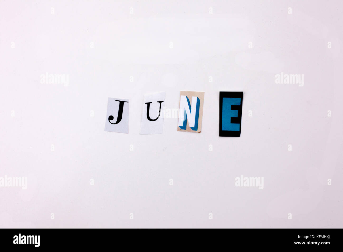 June 01 Letters A word writing text showing concept of JUNE made of different magazine ...