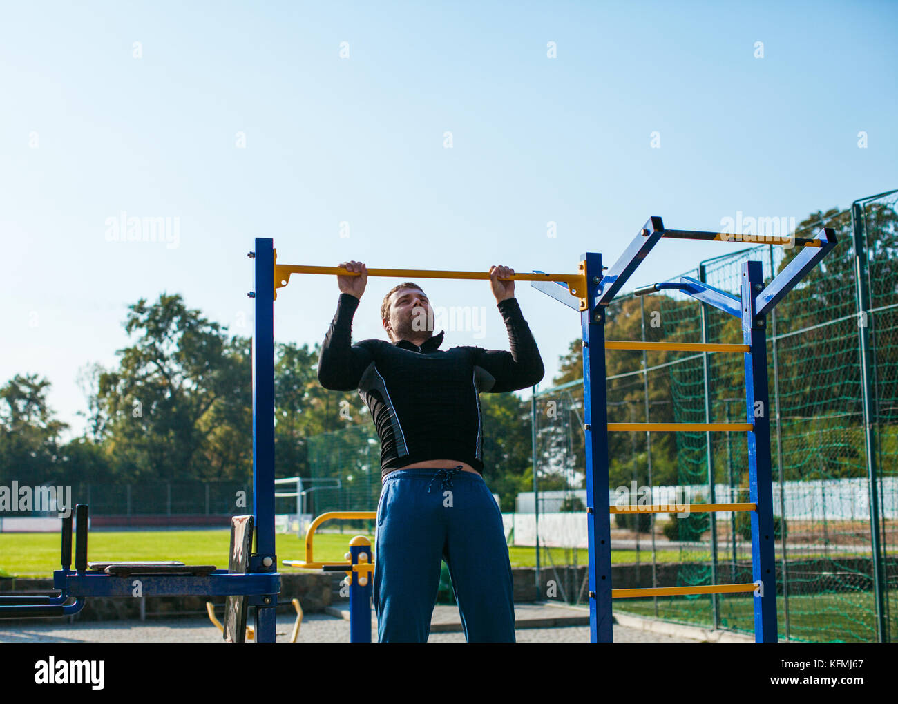 The man workout on the crossbar Stock Photo Alamy