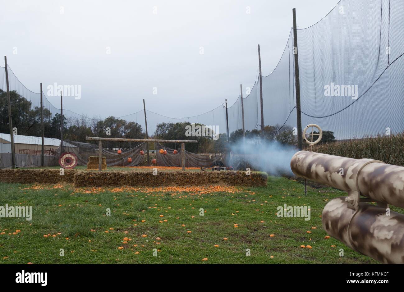 Smoke coming out the end of a pumpkin cannon, at Sever's Fall Festival in Shakopee, Minnesota, USA. Stock Photo