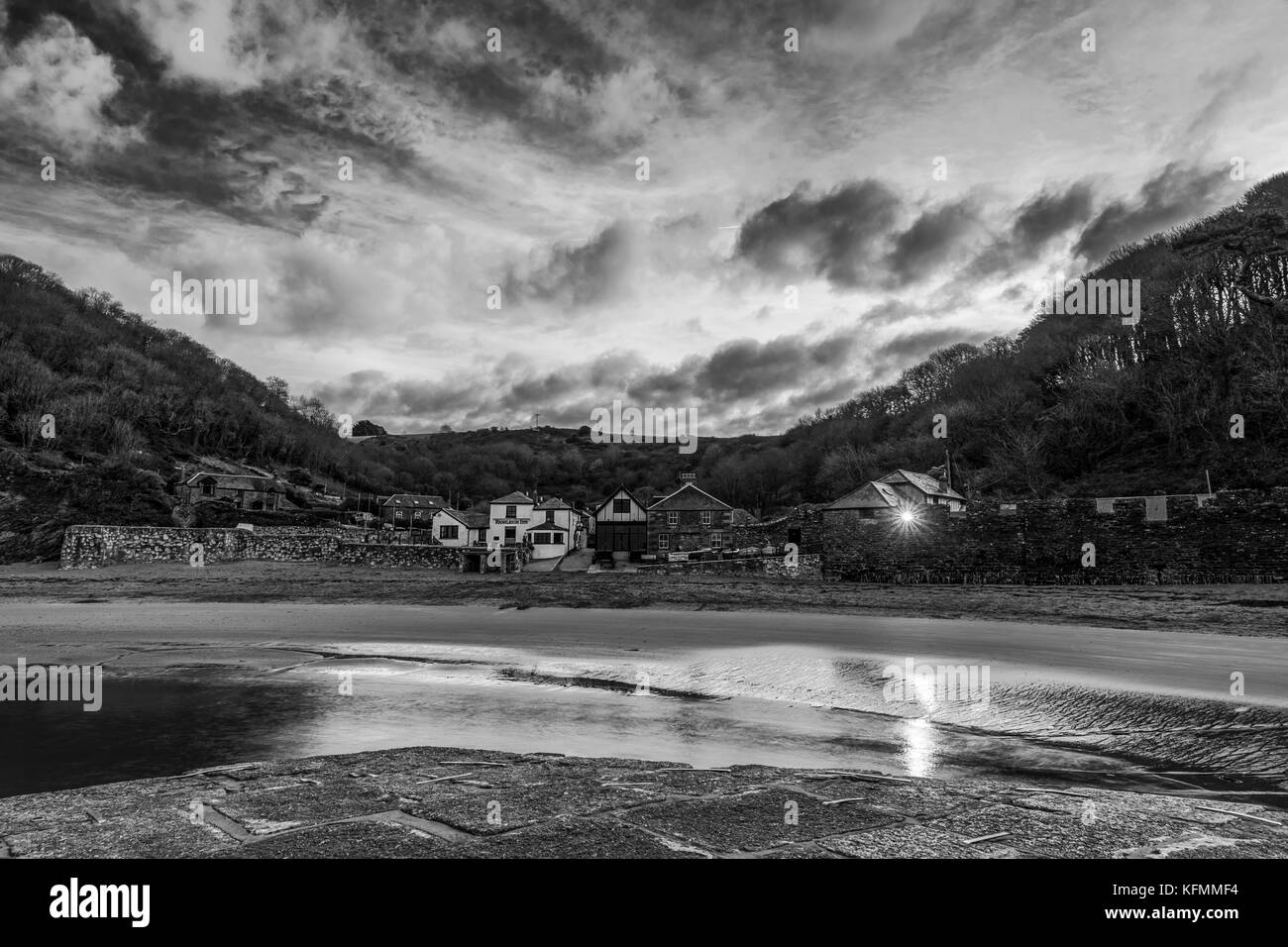 Wide angle photograph encompassing Cornwalls idyllic Polkerris Harbour at the break of Dawn. Stock Photo