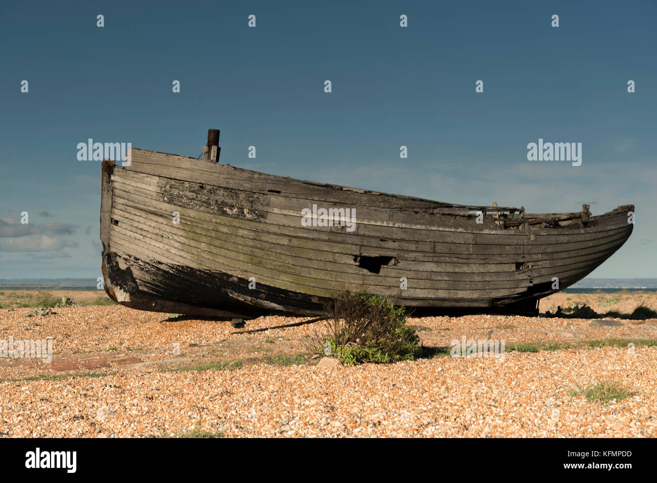 Derelict fishing boat abandoned on Dungeness beach Stock Photo - Alamy