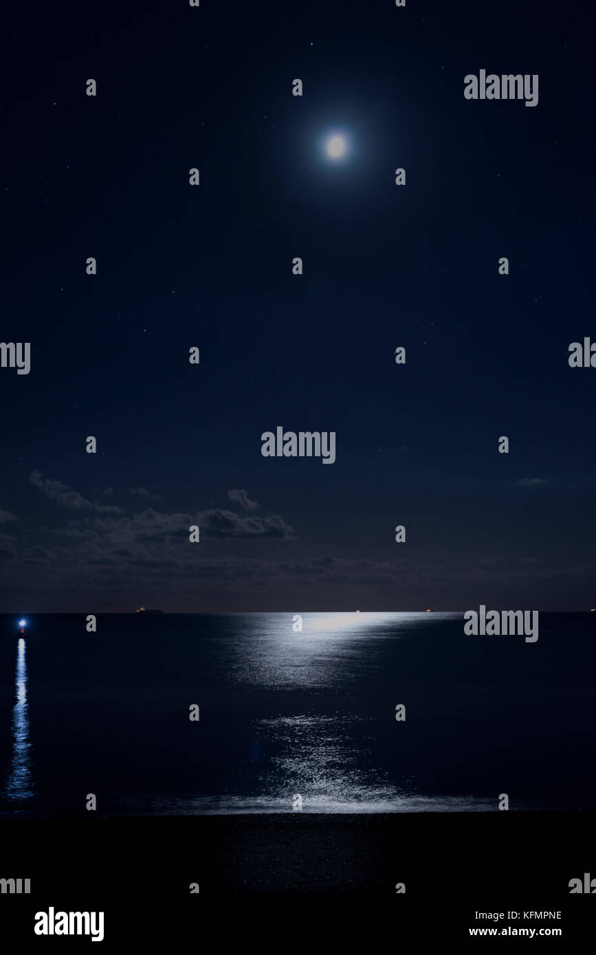 moonlight reflected on the surface of the sea Stock Photo