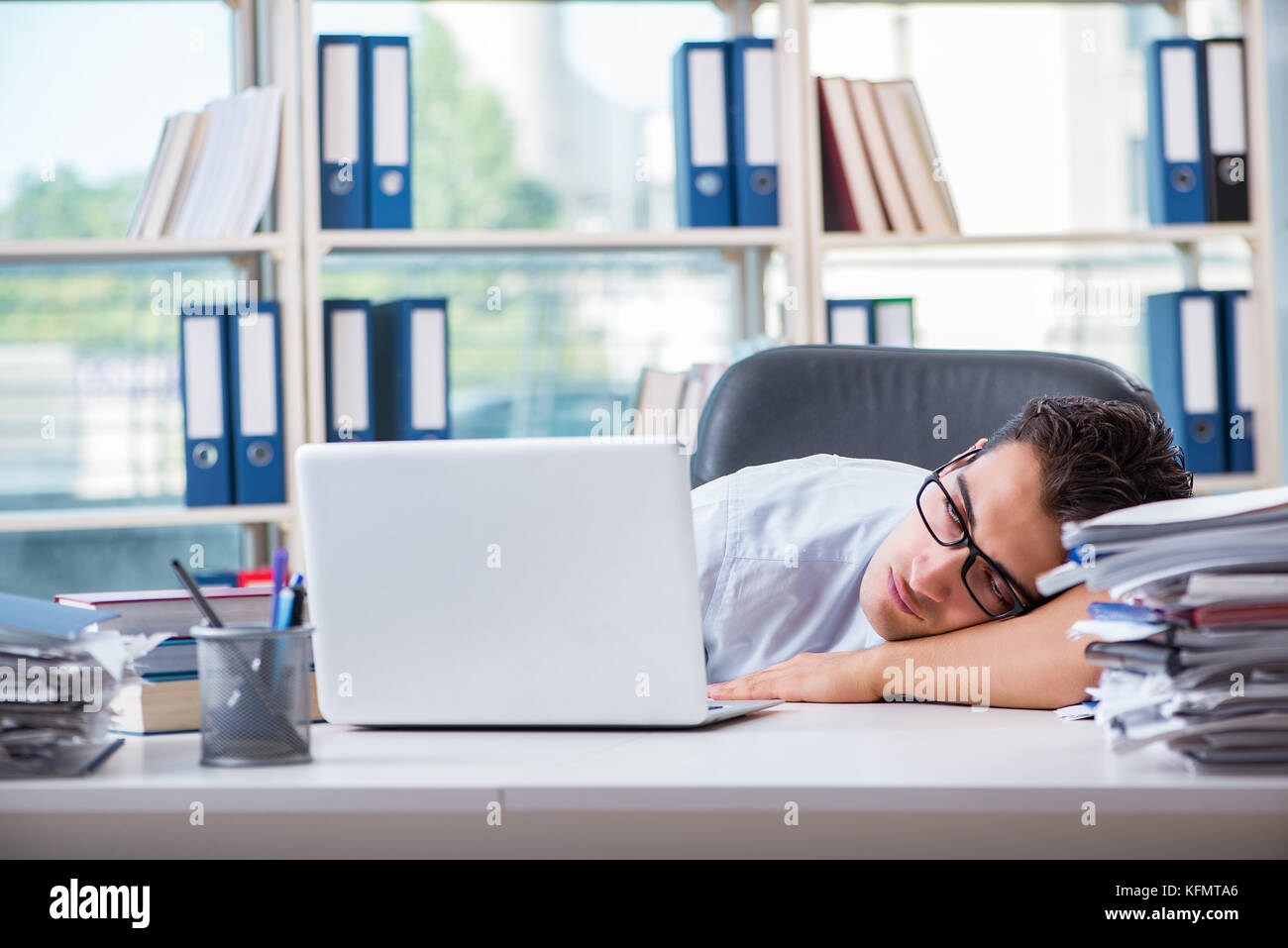 Tired exhausted businessman sitting in the office Stock Photo - Alamy