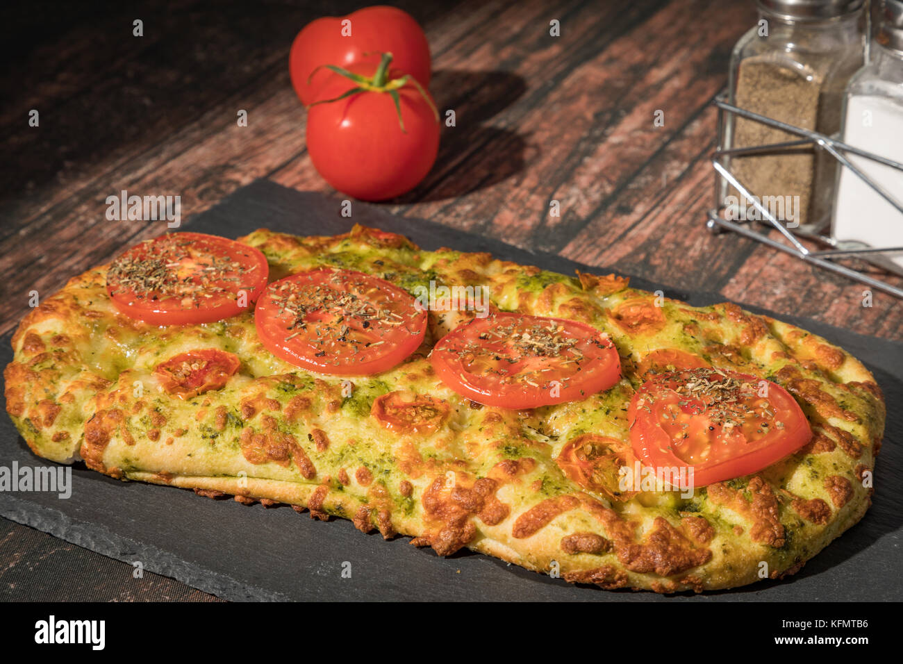 Freshly cooked cheese and tomato flatbread Stock Photo Alamy