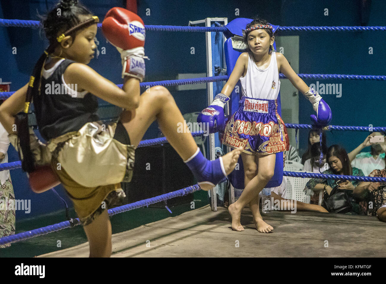 Girls. At right Hasana, 7 years old and 7 matches, Muay Thai fighters going through pre-fight ritual, Thailand Stock Photo