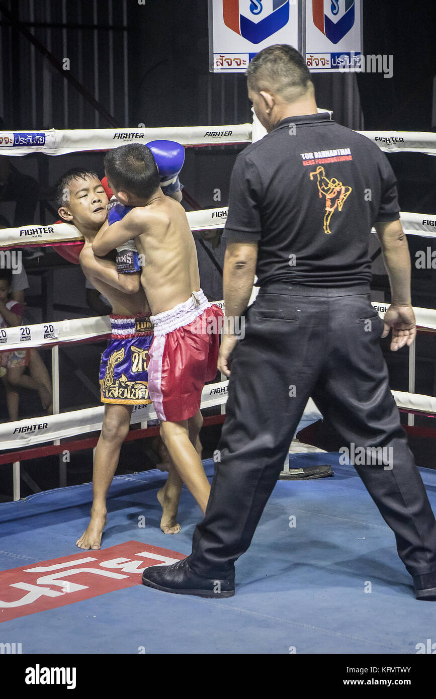 Boys Muay Thai Boxers Fighting And Referee Paktonchai Korat