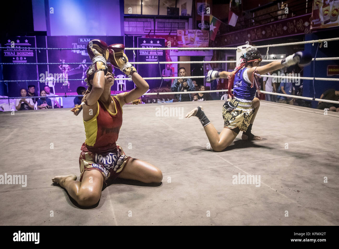 At left Sarania 11 years old. At right Nya, 11 years old. Muay Thai fighter going through pre-fight ritual, Thailand Stock Photo