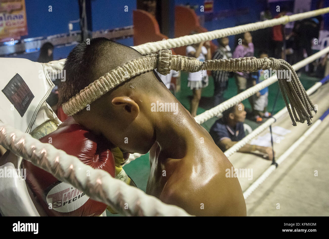 Boy muay Thai fighter through pre-fight ritual, Thailand Stock Photo