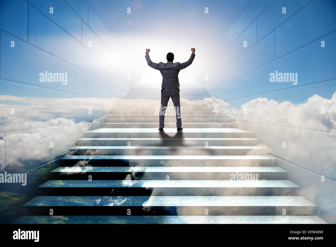 Businessman climbing up challenging career ladder in business concept ...