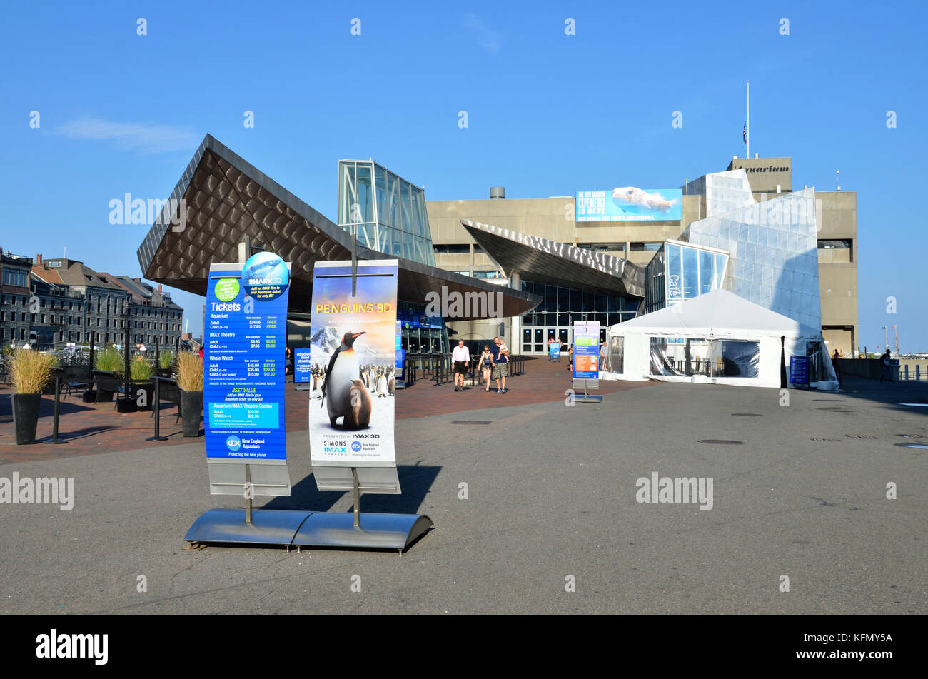 Exterior of the New England Aquarium with ticket posters on the Boston