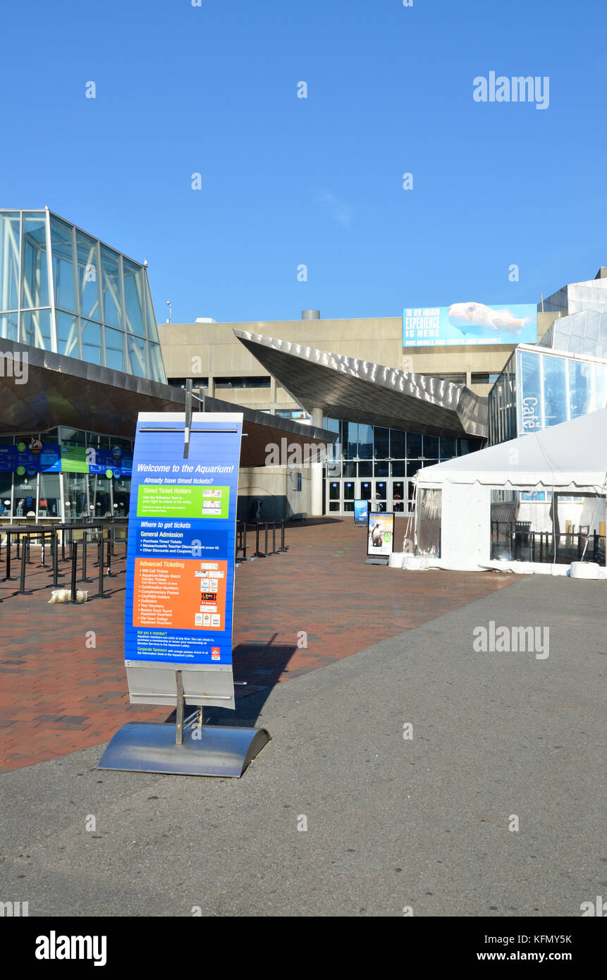 Exterior of the New England Aquarium with ticket posters on the Boston