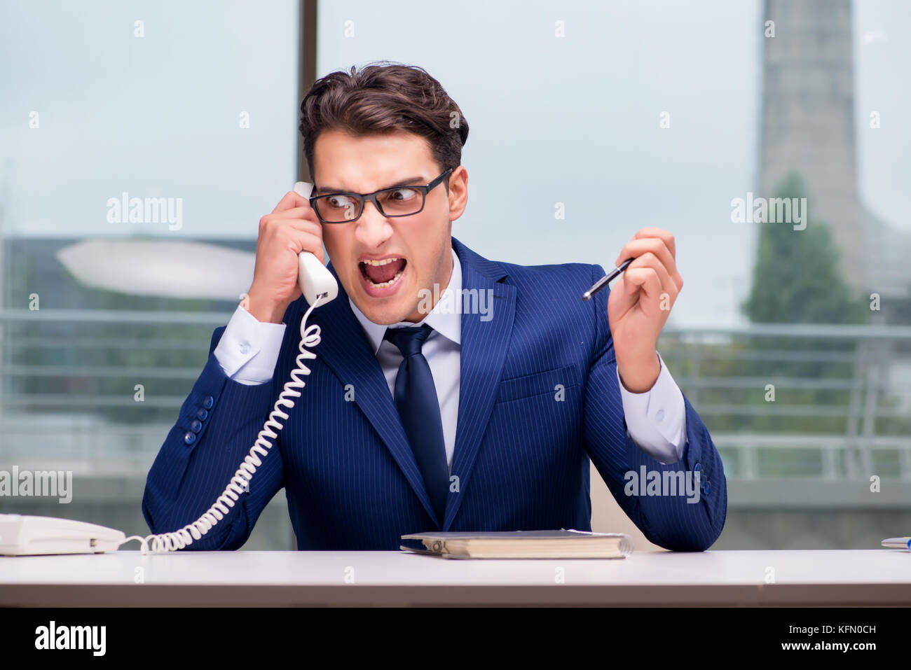 Angry call center employee yelling at customer Stock Photo - Alamy