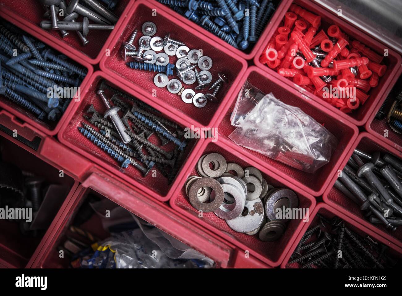 Construction Bolts, Washers and Screws Red Toolbox Closeup Stock Photo