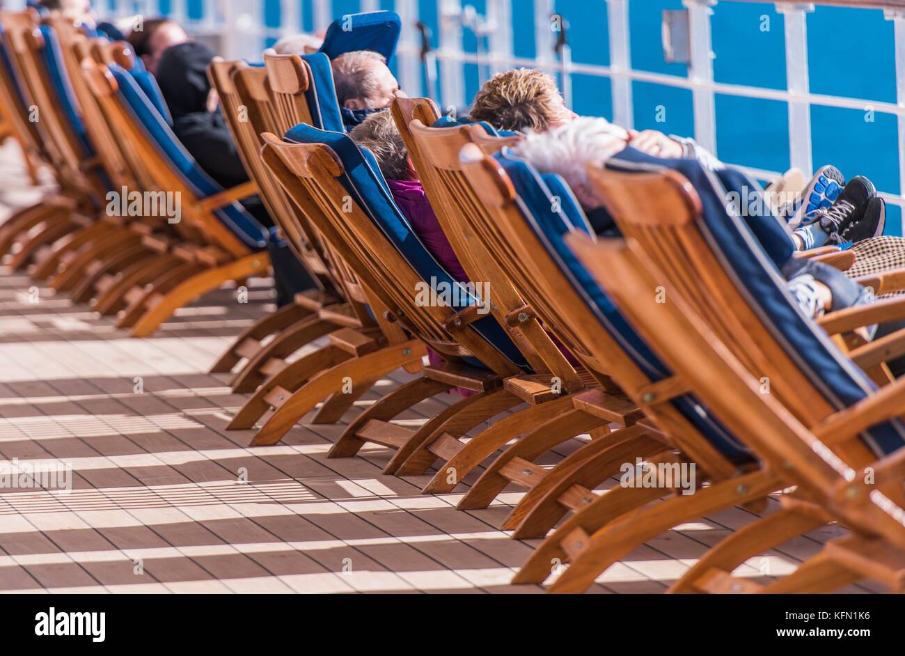 Sea Travel and Cruise Ship Relax. People Relaxing on Deckchairs During ...