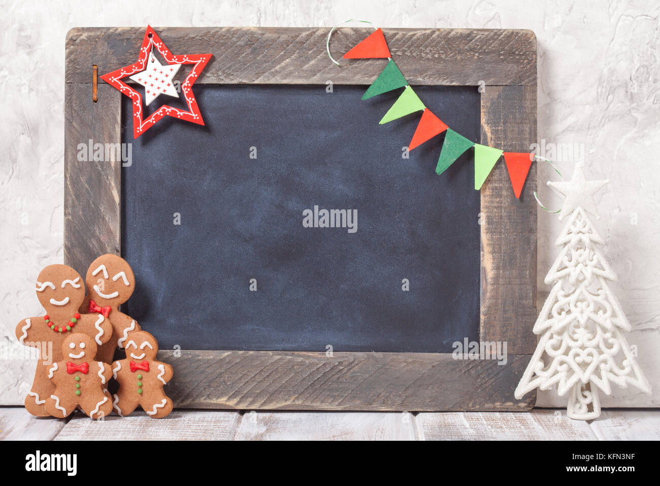 Gingerbread man family and chalkboard Stock Photo