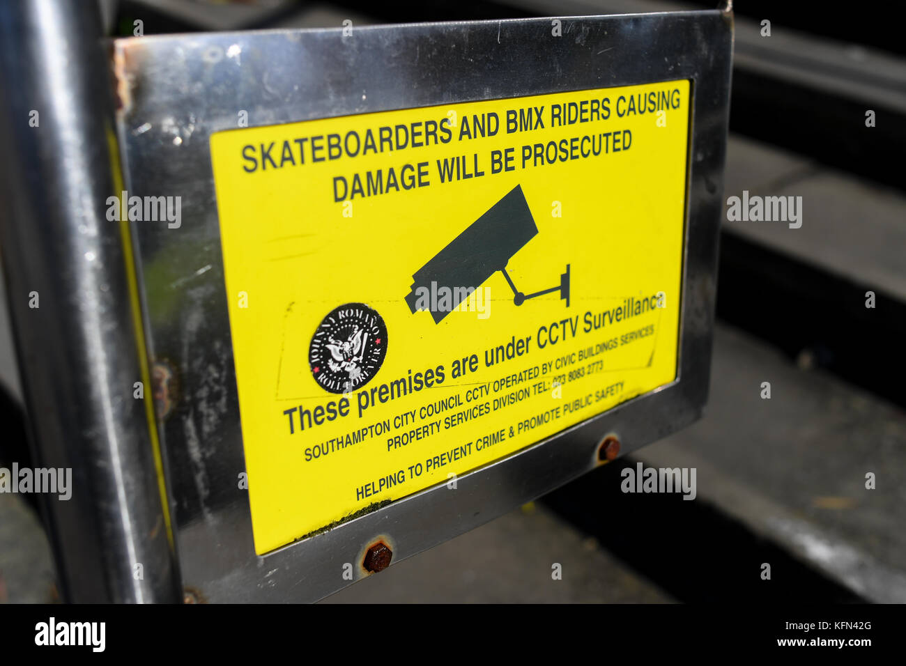 Southampton England, Skateboarders and BMX riders CCTV sign warning of prosecution for damaging property. Stock Photo