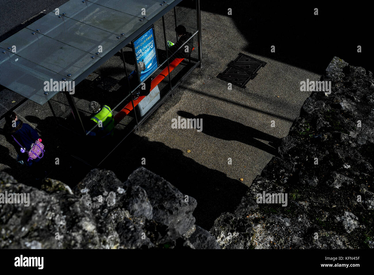 A single male shadow falls on the ground giving a sense of doom or scary unease. Stock Photo