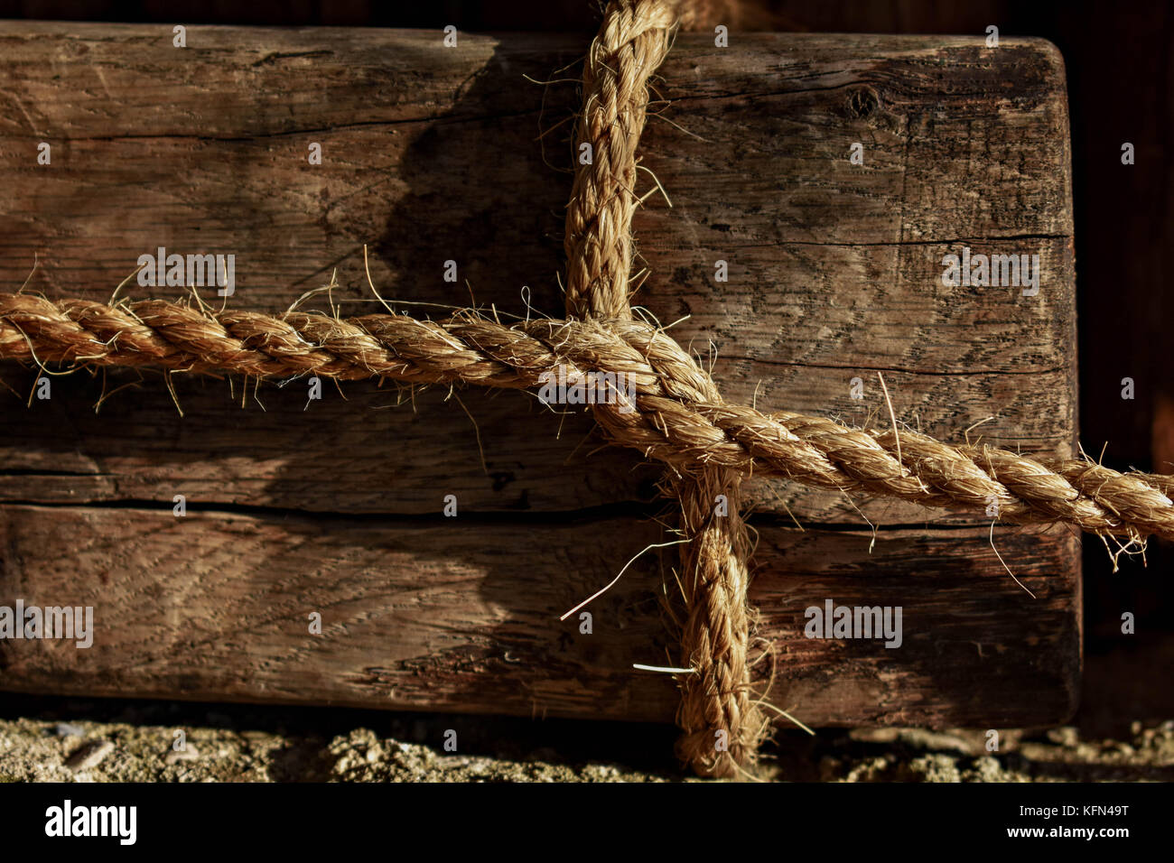 Square Wooden Knot whit white rope Stock Photo