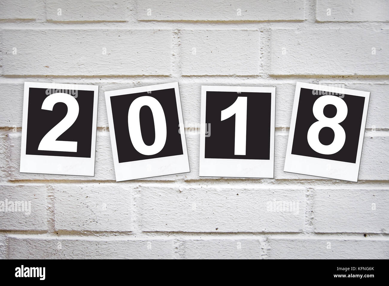 2018 in instant photo frames on a brick wall Stock Photo