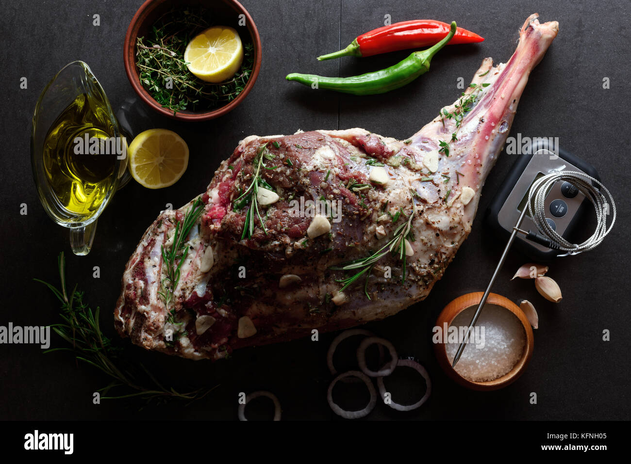 Raw lamb leg, marinated with herbs Stock Photo