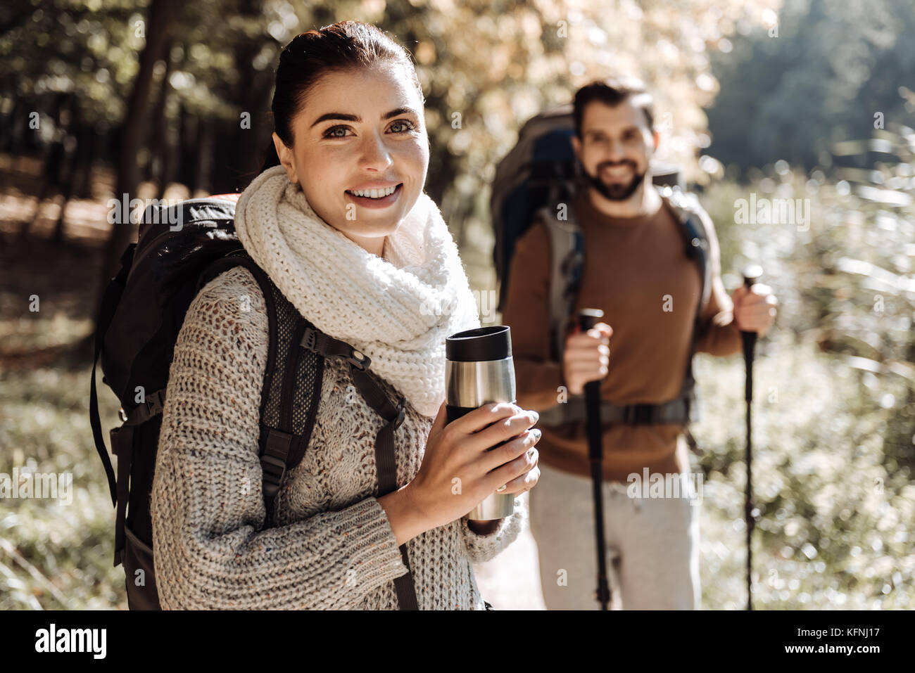 Close up of adorable woman with a thermos bottle Stock Photo
