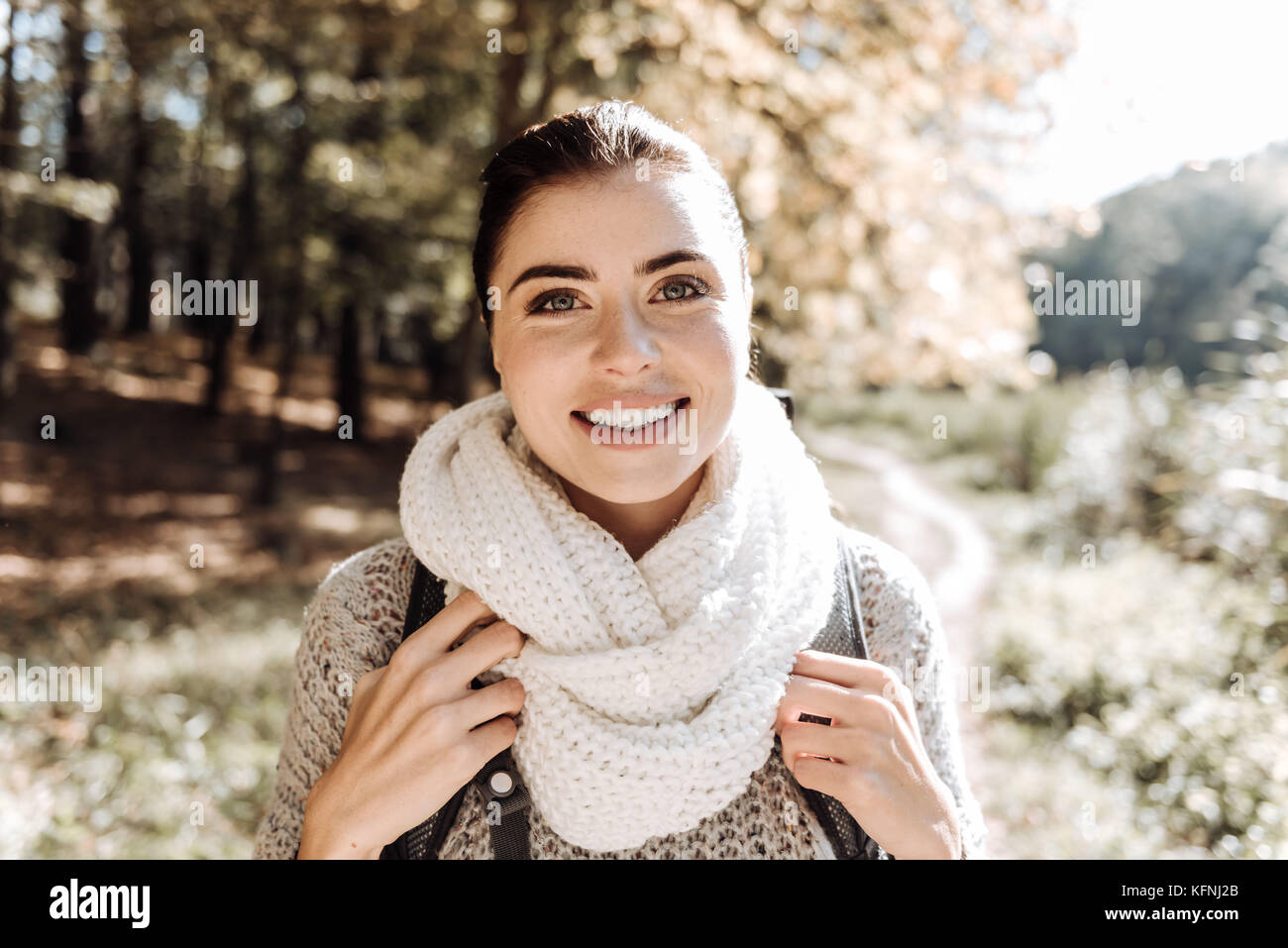 Close up of amused girl smiling at you Stock Photo