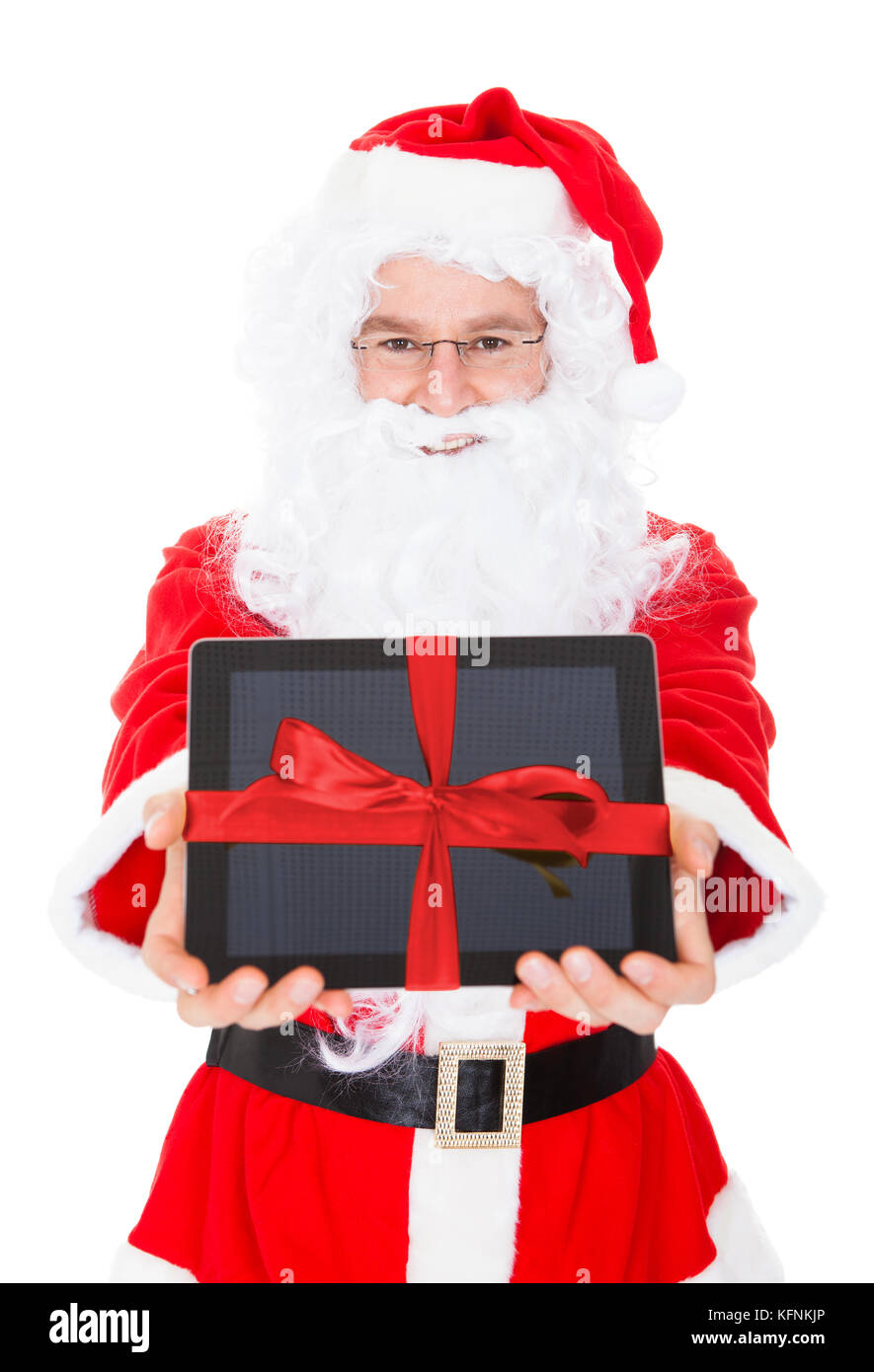 Santa holding digital tablet on white background Stock Photo - Alamy