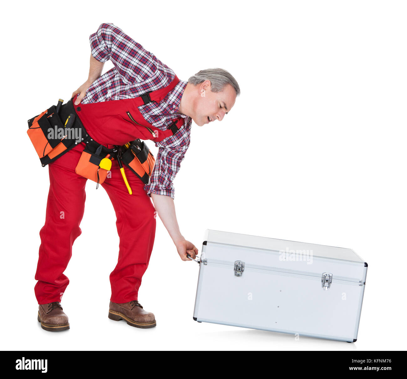 Man Technician With Back Pain Lifting Metal Box isolated on white background Stock Photo