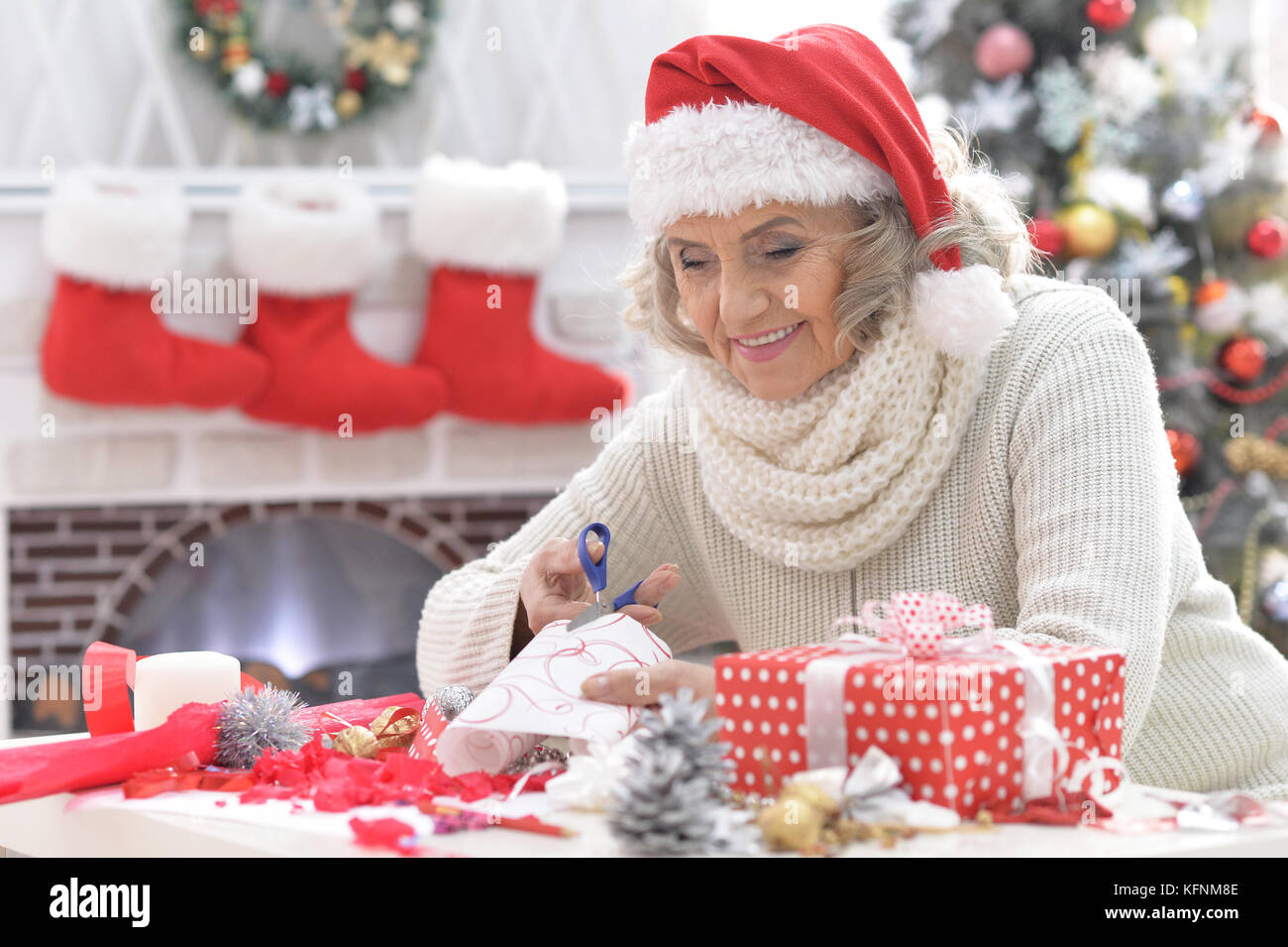 Senior woman in Santa hat Stock Photo - Alamy