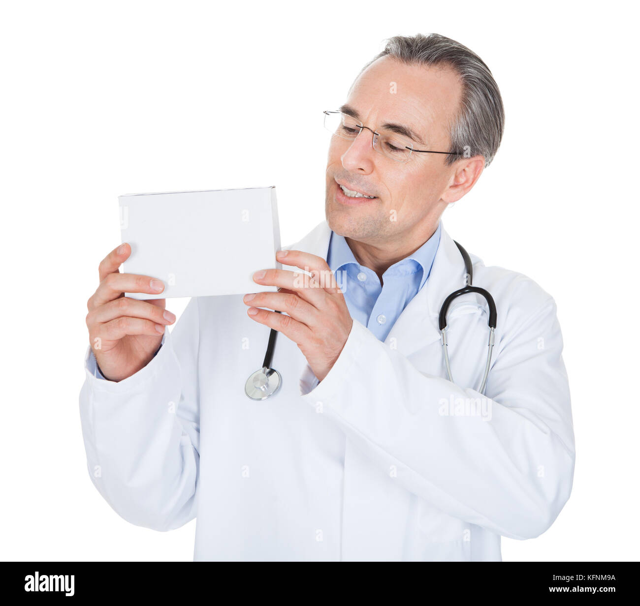 Doctor holding prescription note isolated on white background Stock Photo