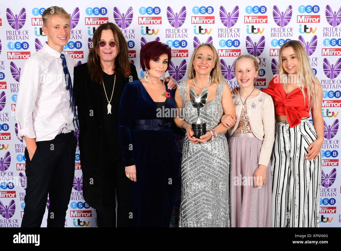 Sharon And Ozzy Osbourne Present A Special Recognition Award To Sarah Hope Centre Right And Children Barnaby Left Pollyanna And Sapphire Right During The Pride Of Britain Awards 2017 At Grosvenor House
