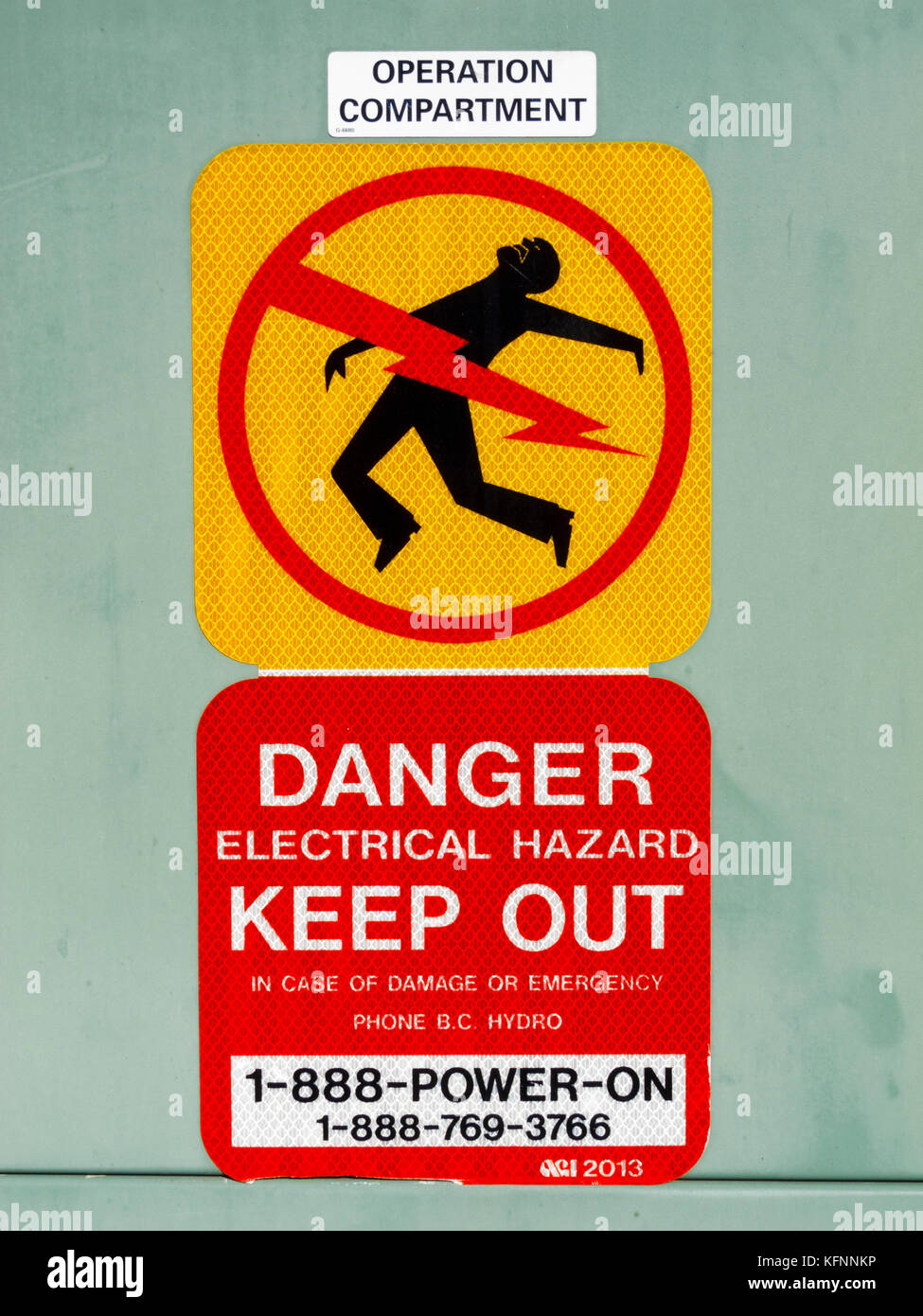 Sign 'Danger, Electrical Hazard, Keep Out' on BC Hydro Transformer Pad Stock Photo