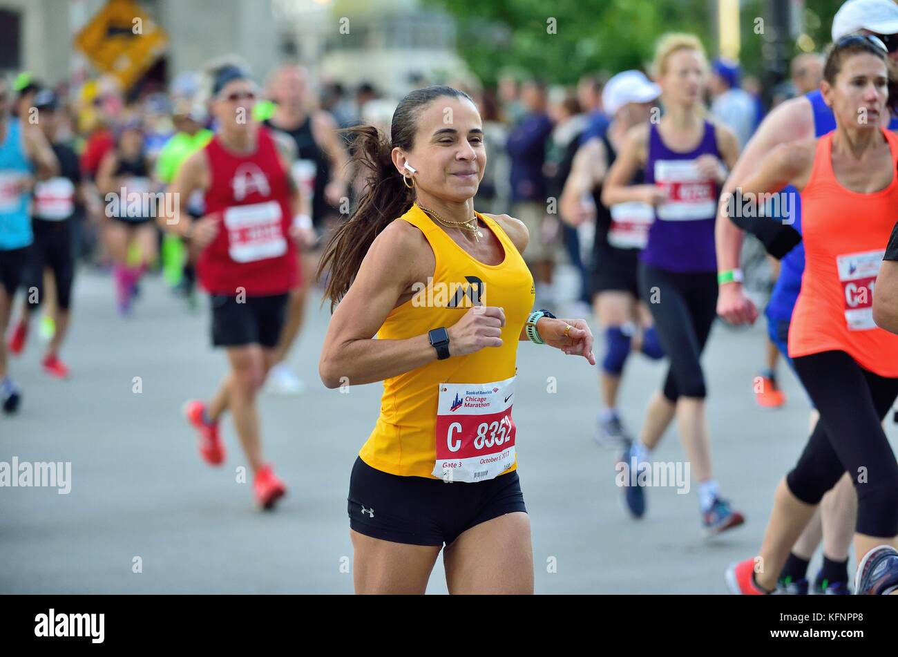 Nanci Salvo of Brazil running among a cluster of competitors during the early stages of the 2017 Chicago Marathon. Chicago, Illinois, USA. Stock Photo