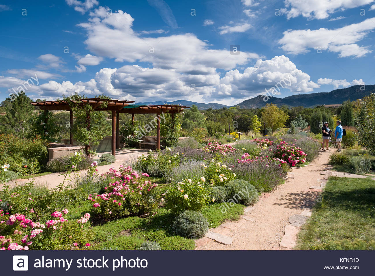 People Walking On Path In The Meadow Garden Area Of The Santa Fe
