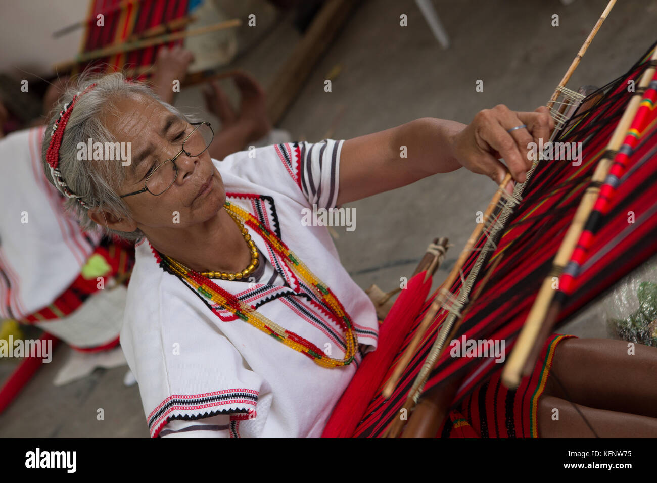 Ifugao women weaving during the annual Imbayah Festival which celebrates the age old traditions of the Ifugao Indigenous tribes of Banaue,Philippines. Stock Photo