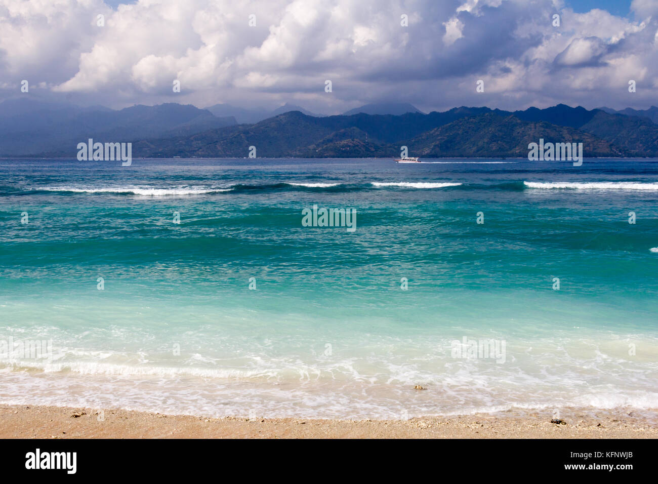 Dramatic clouds hover over mountains Gili Trawangan, Indonesia Stock Photo