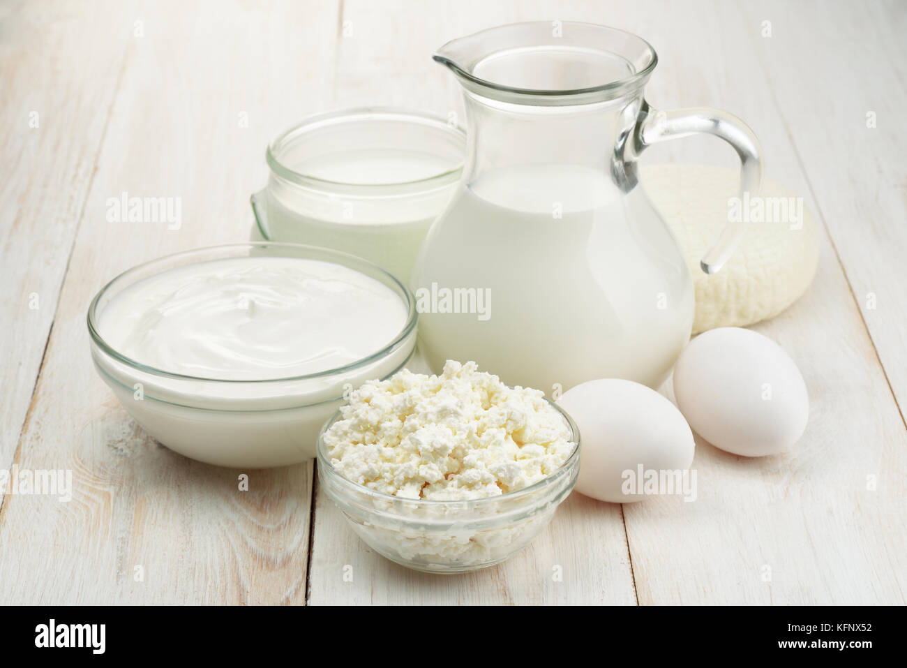 Fresh dairy products on white wooden background Stock Photo